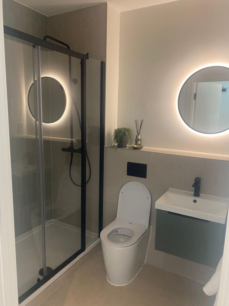 Novello — completed bathroom with backlit mirrors